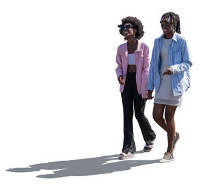 two backlit black women walking