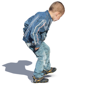 blond boy playing on the street