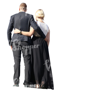 couple in formal clothes standing together on a balcony