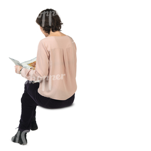 woman sitting and reading a newspaper