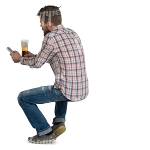 man sitting in a cafe and drinking beer