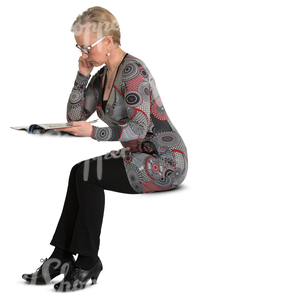 woman sitting at the table and reading a newspaper