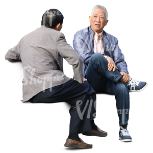 two older asian men sitting and talking