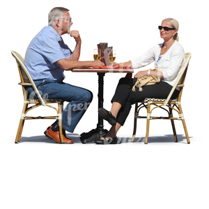 man and woman sitting in a cafe and drinking wine