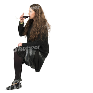 young woman sitting in a cafe and drinking wine