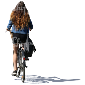 woman with long hair riding a bicycle