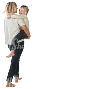 woman walking and carrying her son in her arms