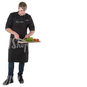 young chef cutting vegetables