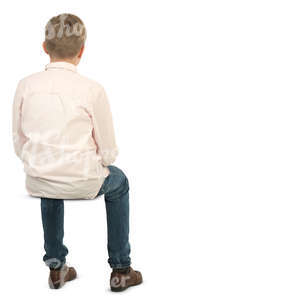 young boy sitting on a chair