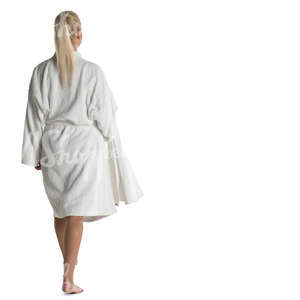 woman in a white bathrobe walking