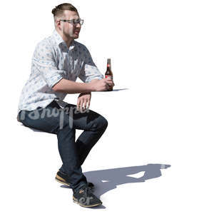 man sitting in a cafe and drinking beer