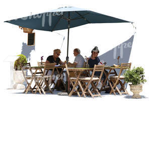 three people sitting in a street cafe