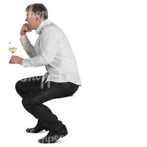 man sitting in a cafe and drinking white wine