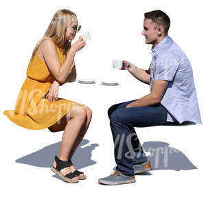 couple sitting in a cafe and drinking coffee