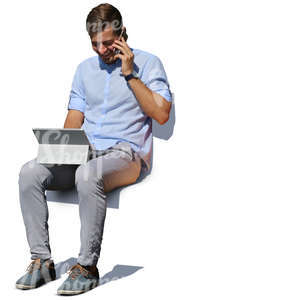 man sitting on a bench and working with laptop