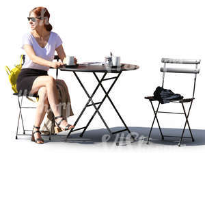 woman sitting in a street cafe