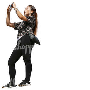 asian woman standing on a balcony and taking pictures