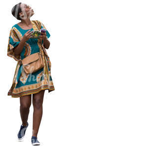 african woman in a colorful dress walking