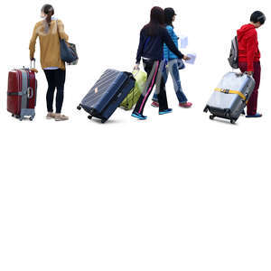 four asian women travelling with big suitcases