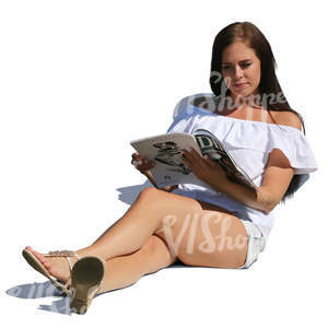 woman sitting and reading a magazine