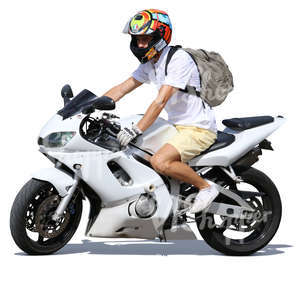 man in shorts riding a motorcycle