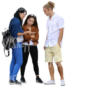 group of three people standing and looking at smth on the phone