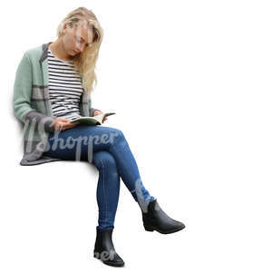 blond woman sitting and reading a book