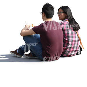 asian couple sitting on the ground