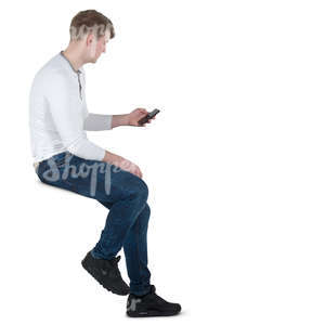 man sitting on a bar stool and texting