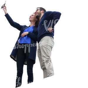 man and woman standing on a balcony and taking a selfie