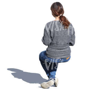 woman in a grey sweater sitting