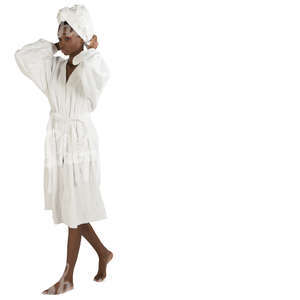 african woman in a white bathrobe walking