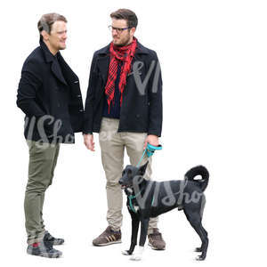 two men and a dog standing and talking