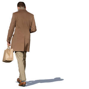 man in a light brown jacket walking