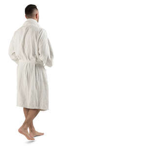 man in a white bathrobe walking