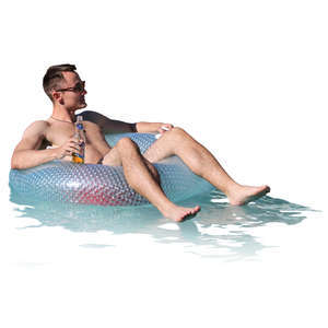 man floating with a swimming ring in a pool