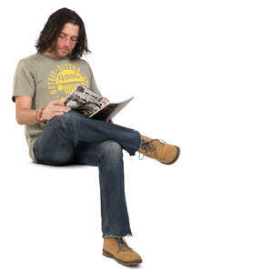 man sitting and reading a magazine