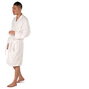 asian man in a bathrobe walking