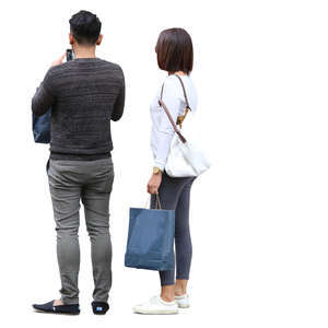 asian couple with shopping bags standing