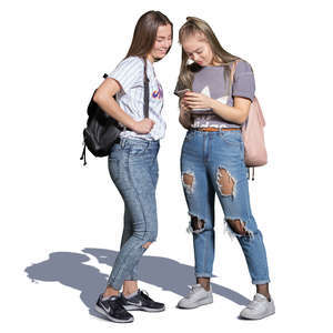 two teenage girls standing and looking at the phone