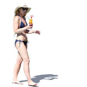 woman in a bikini walking with a cocktail in hand