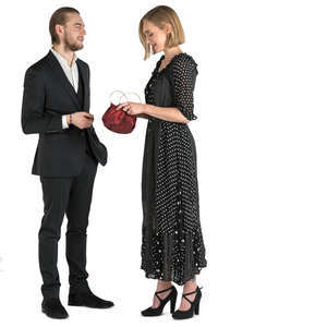 man and woman in formal wear standing and talking