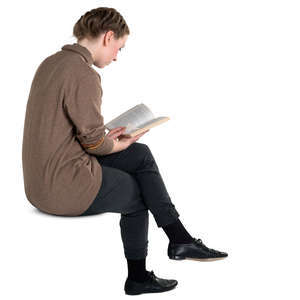 young woman sitting and reading a book