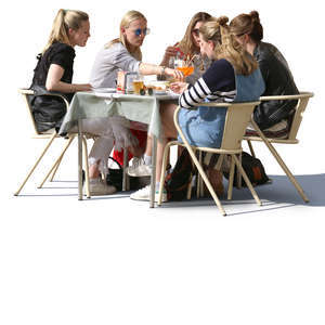 group of women sitting at a street cafe