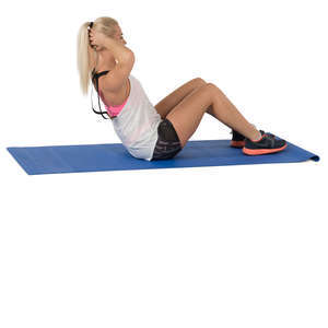 woman doing exercises on a yoga mat