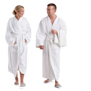 man and woman in white bathrobes walking