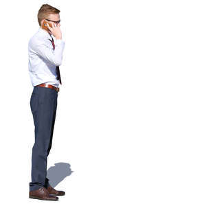 young businessman standing and talking on a phone