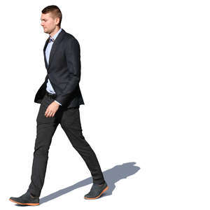 man in a suit walking on a sunny day