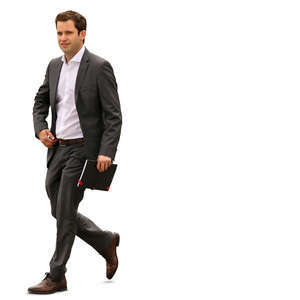 businessman with a notebook walking in the office