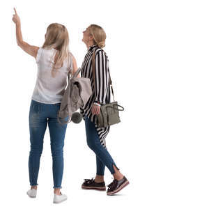 two women standing and pointing at smth
